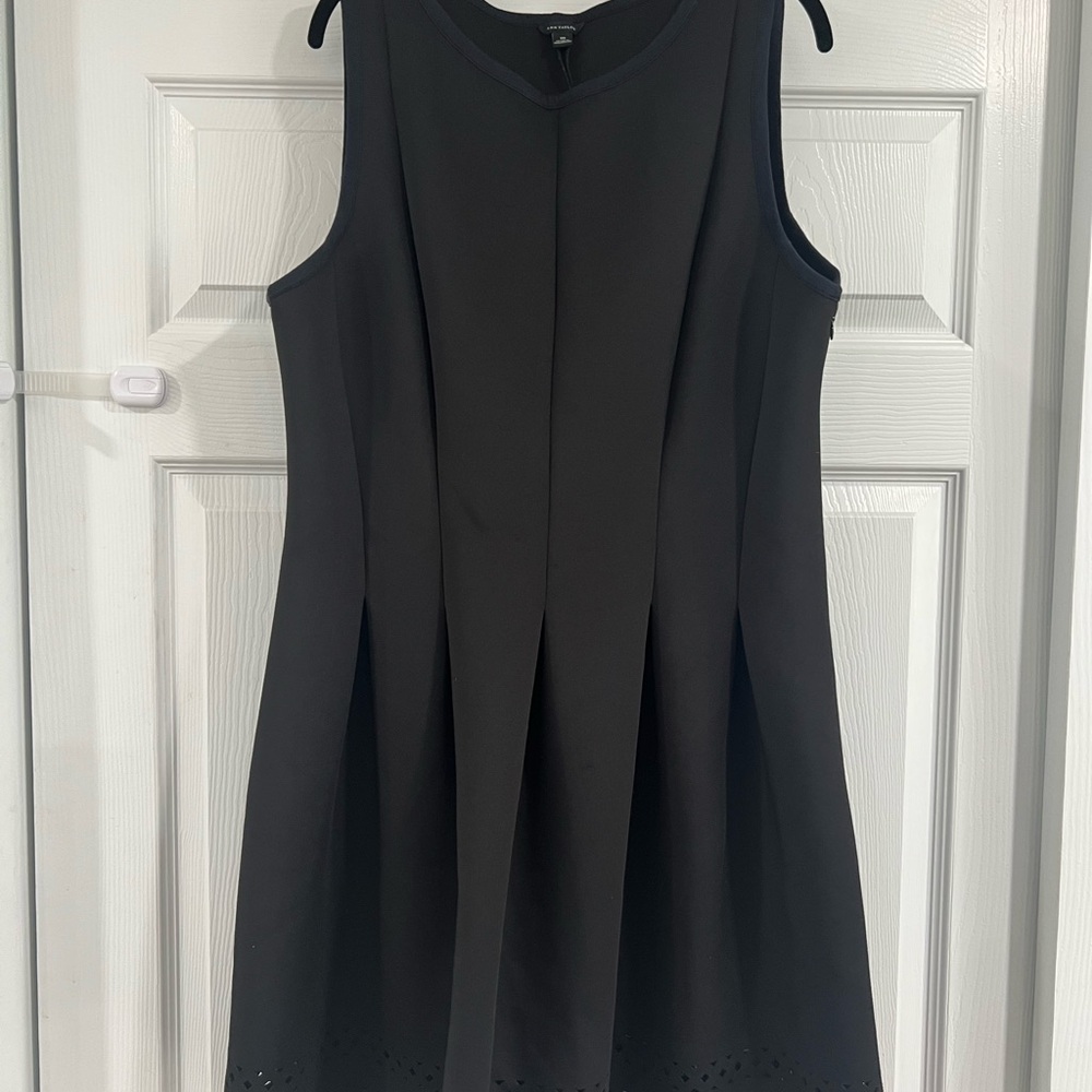 Elegant Black Sleeveless Dress with Geometric Eyelet Detail